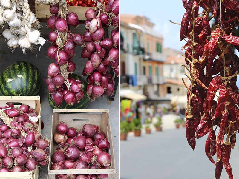 Cebola roxa da Calábria em feira de rua e pimenta calabresa pendurada