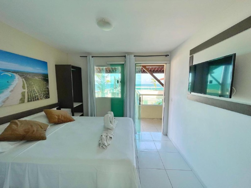 Quarto da Onda do Mar com cama de casal, TV e varanda